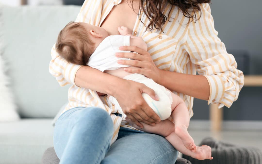 a woman breastfeeding her baby